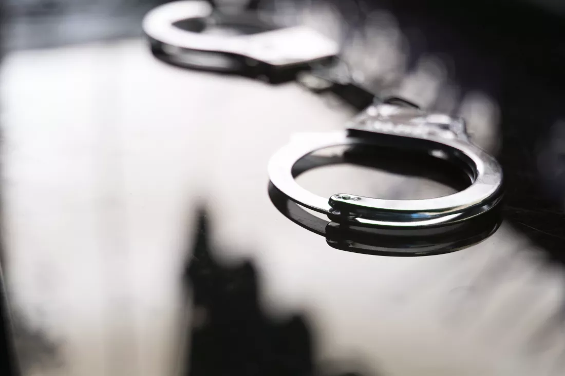 close-up-handcuffs-table